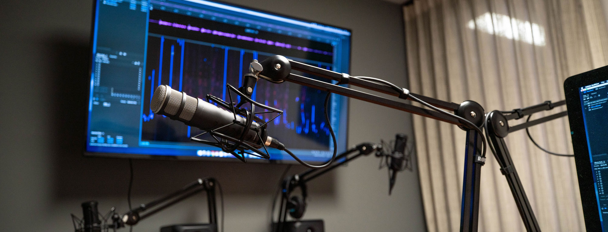 Digital Learning Studios' new podcast room microphones and screen