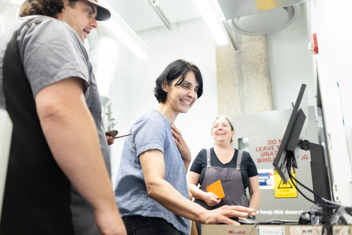 ADLI 2024 participants in the CATalyst Studio's laser cutter room.
