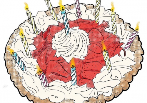 pie with strawberry and cream toppings with 12 candles on top